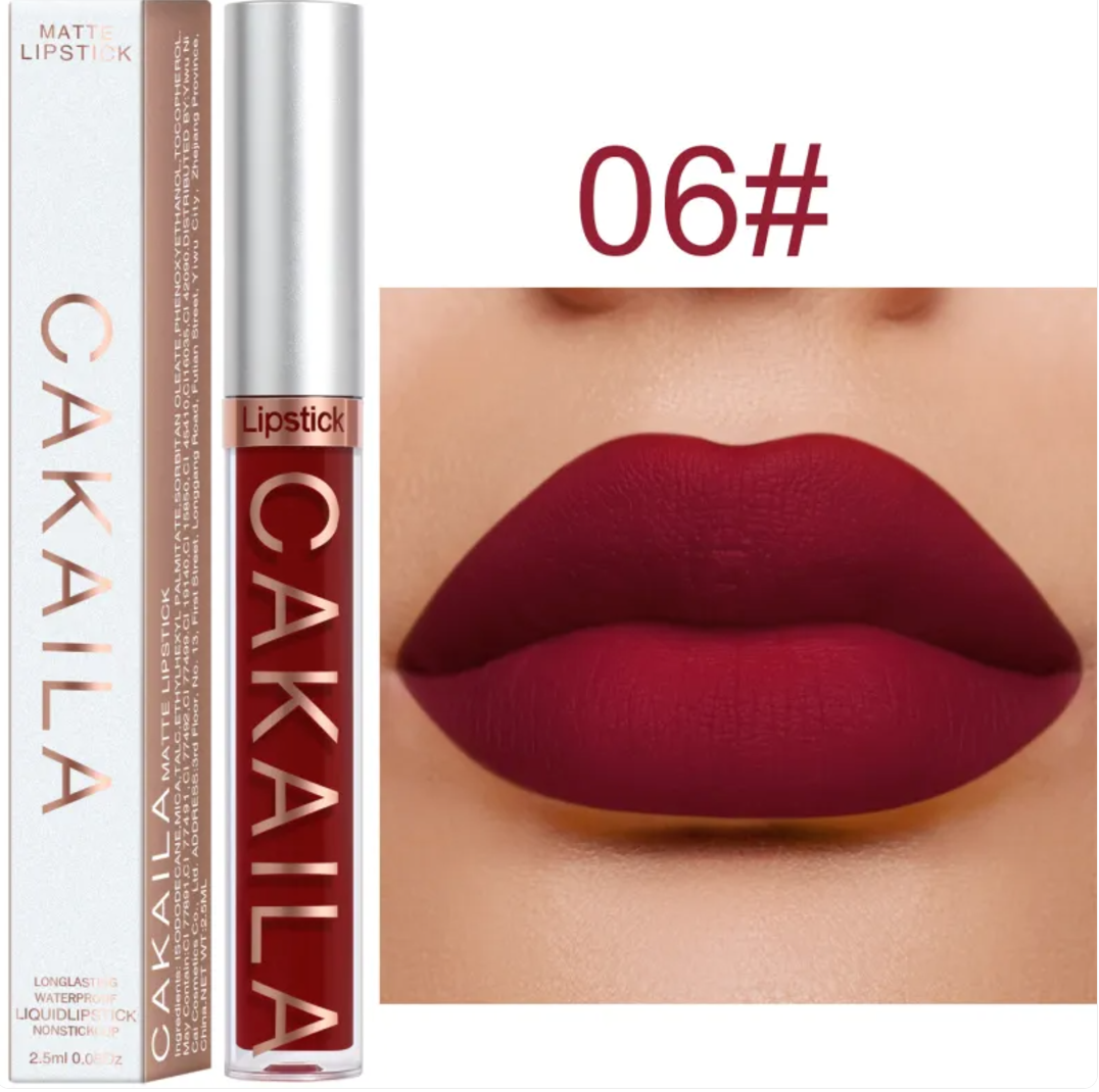 Shade 02 of the VelvetGlow™ lip color shown as a tube, box, and coral-pink lip swatch