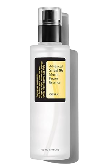 Frosted pump bottle of the MoonDew™ snail mucin essence with black and gold labeling