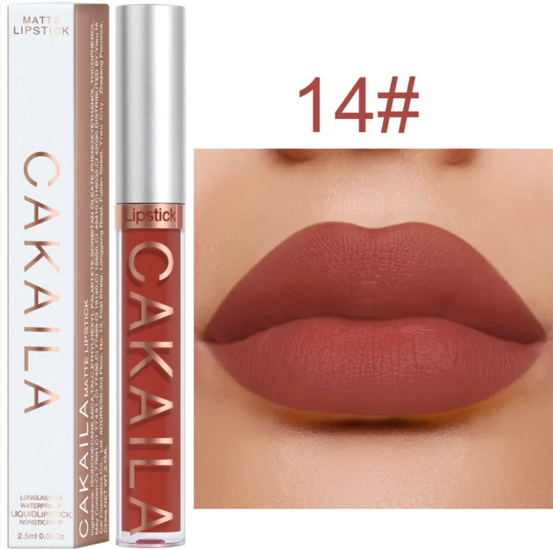 Shade 14 of the VelvetGlow™ lip color shown as a tube, box, and matte brick-brown lip swatch