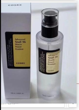 MoonDew™ snail mucin essence bottle and box standing on a white surface