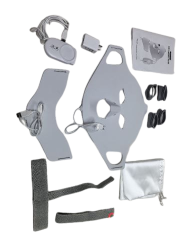 Flat lay of the gray silicone LuminaGlow™ LED face and neck mask kit with controller and accessories