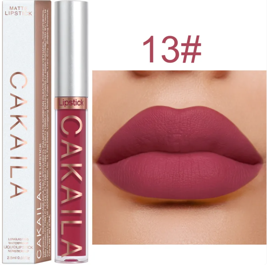 Shade 13 of the VelvetGlow™ lip color shown as a tube, box, and mauve pink lip swatch